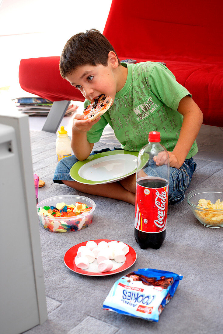 Child snacking and watching TV
