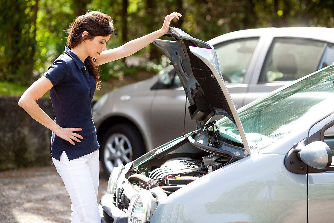 Woman with a car trouble