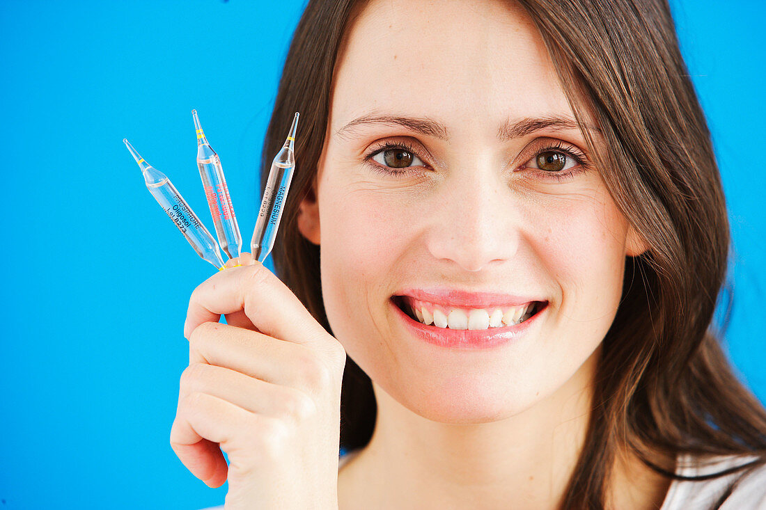 Woman holding ampoules