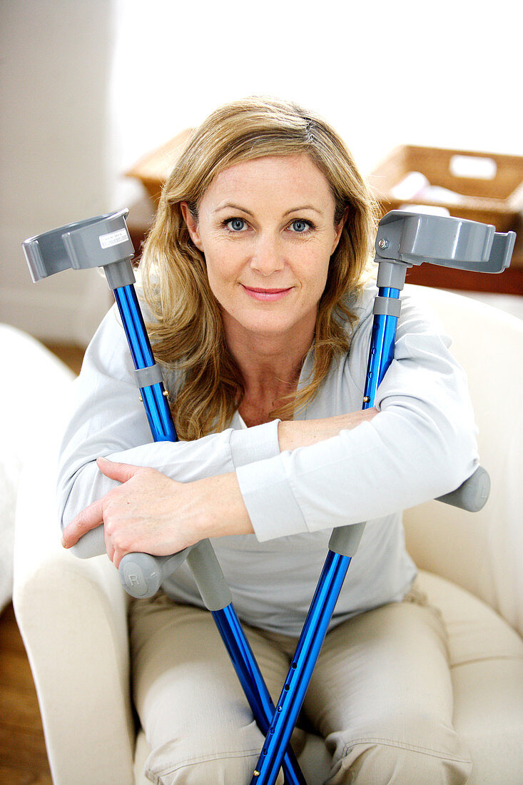 Woman with crutches