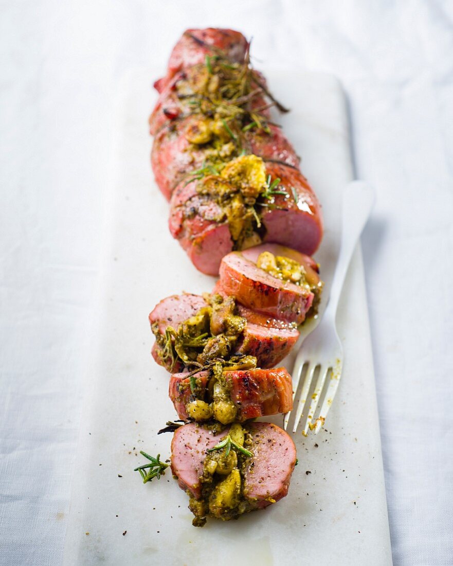 Stuffed pork fillet with figs, hazelnuts and pesto