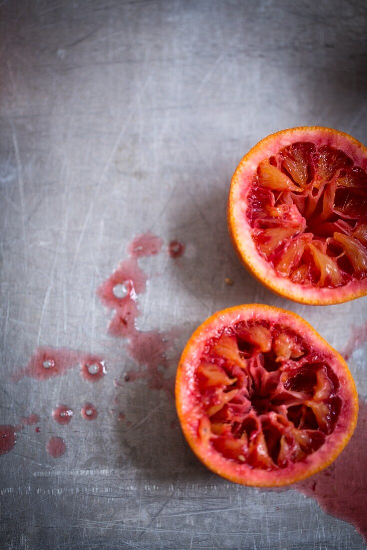 Pressed blood orange halves (seen from above)