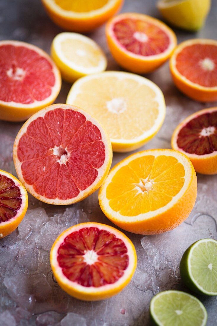 Assorted citrus fruits cut in half