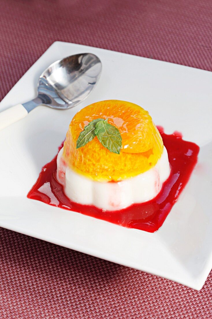 Mandarin dessert with raspberry sauce
