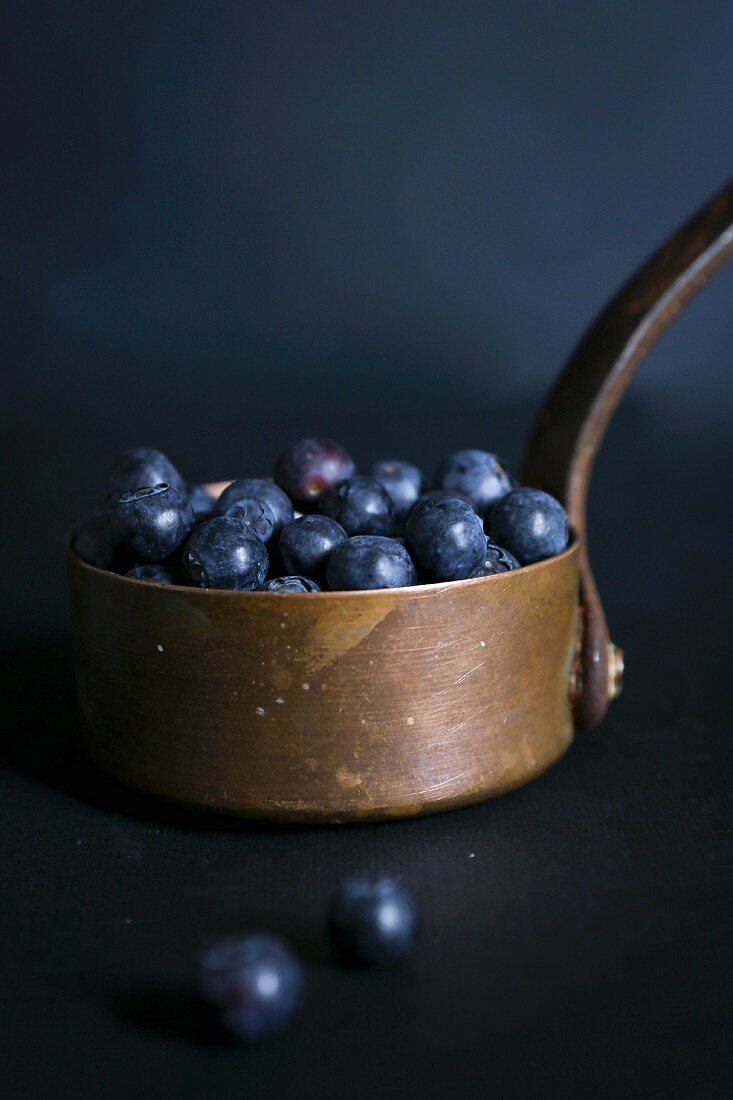 Blueberries in a copper pot