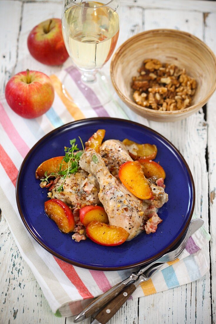 Chicken legs in cider with apples and walnuts