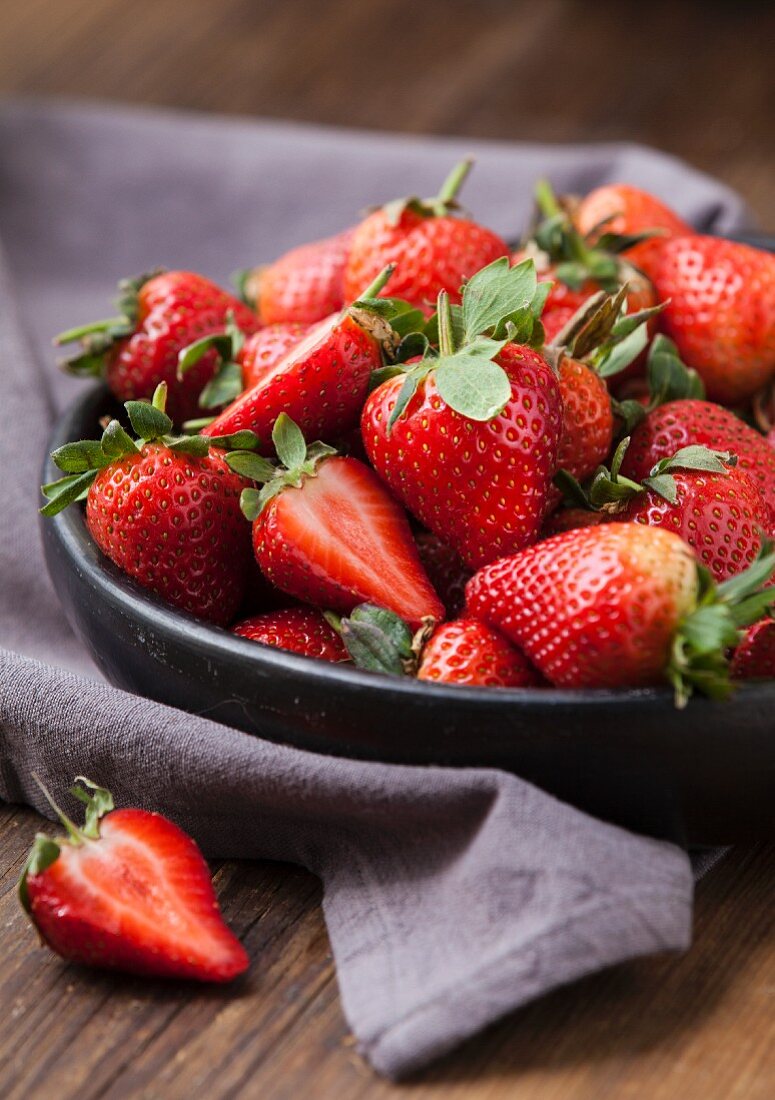 Strawberries in a black bowl