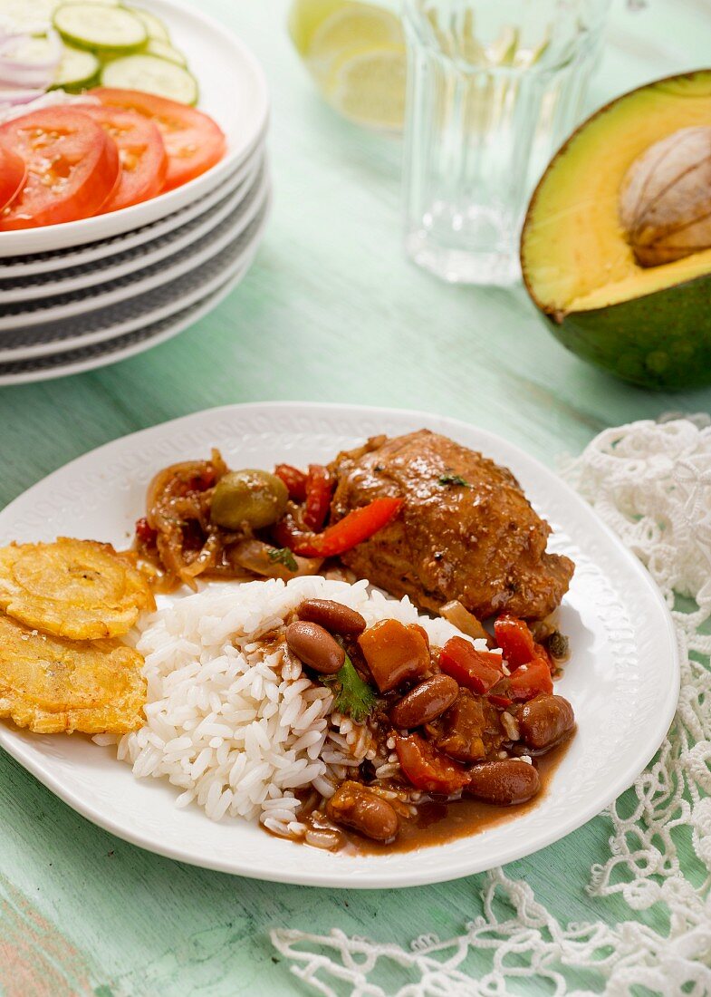 Braised chicken with beans, rice and tostones (Dominican Republic)