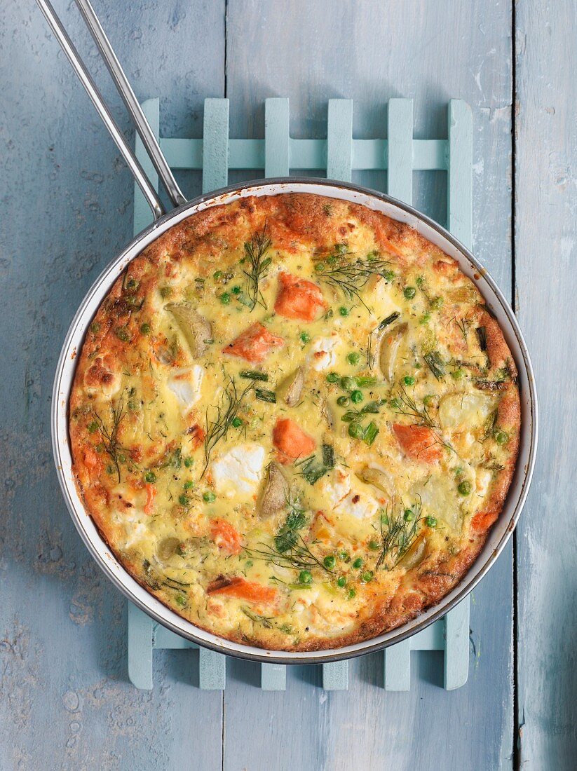 A salmon frittata in a pan (seen from above)