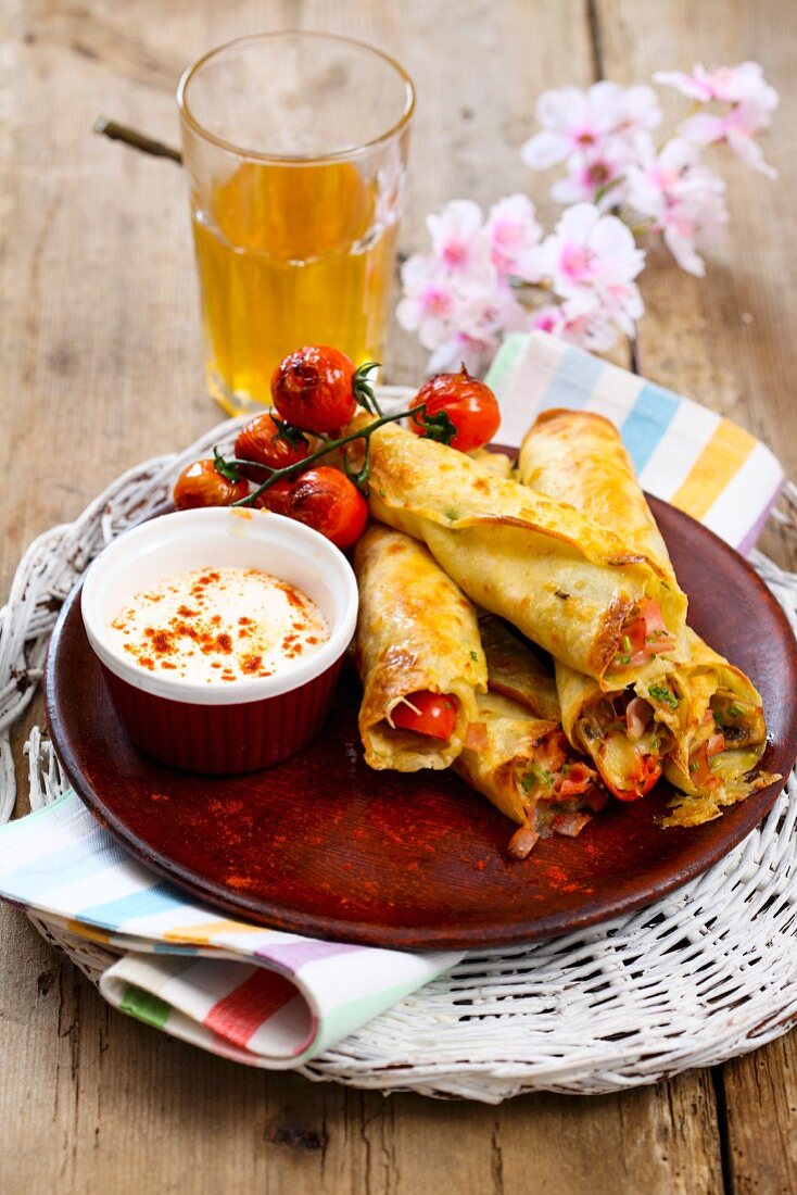 Pancakes filled with cheese, ham, mushrooms and chives served with oven-roasted tomatoes and sour cream