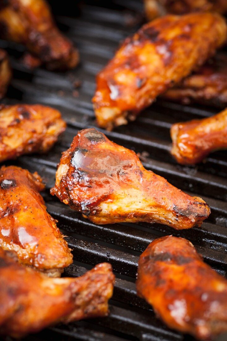 Glazed chicken wings on a grill