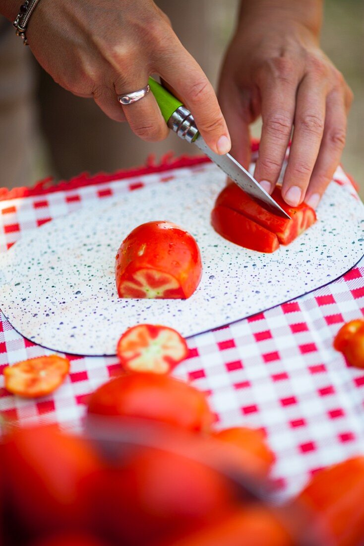 Tomatoes being sliced