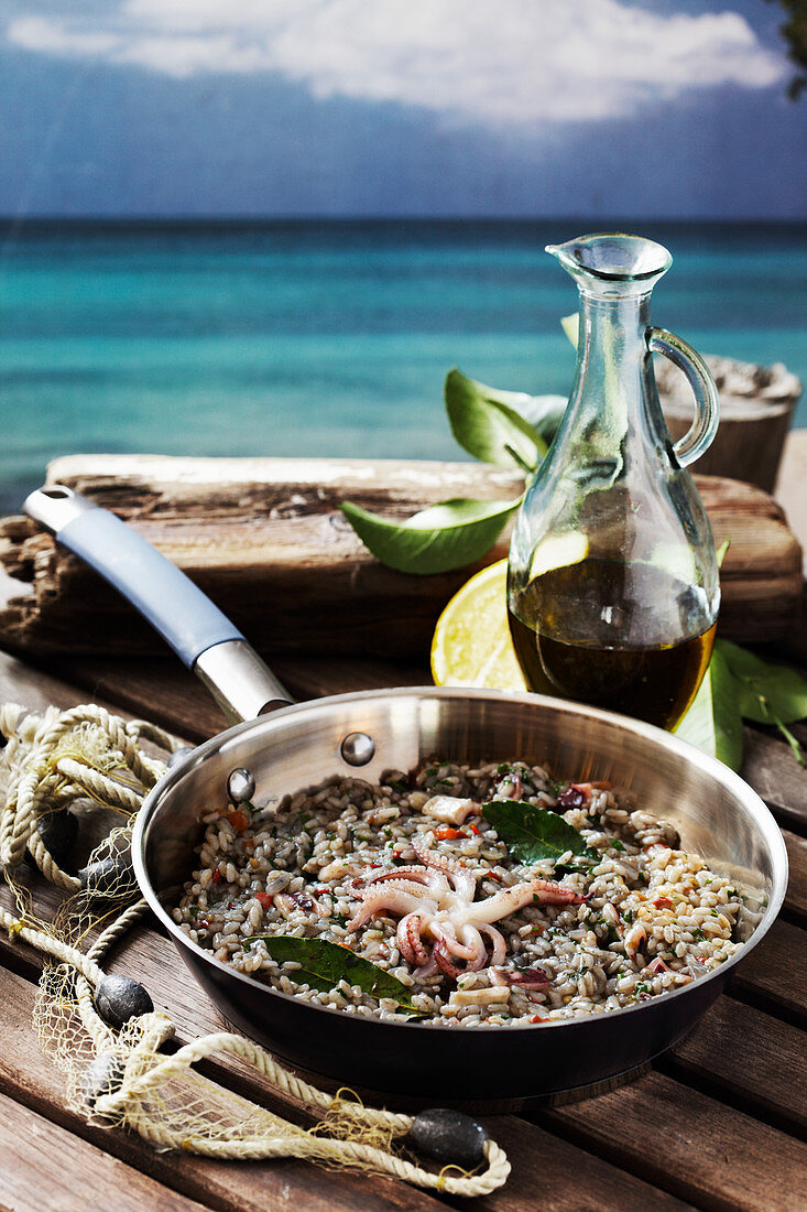 Seafood risotto with bay leaves
