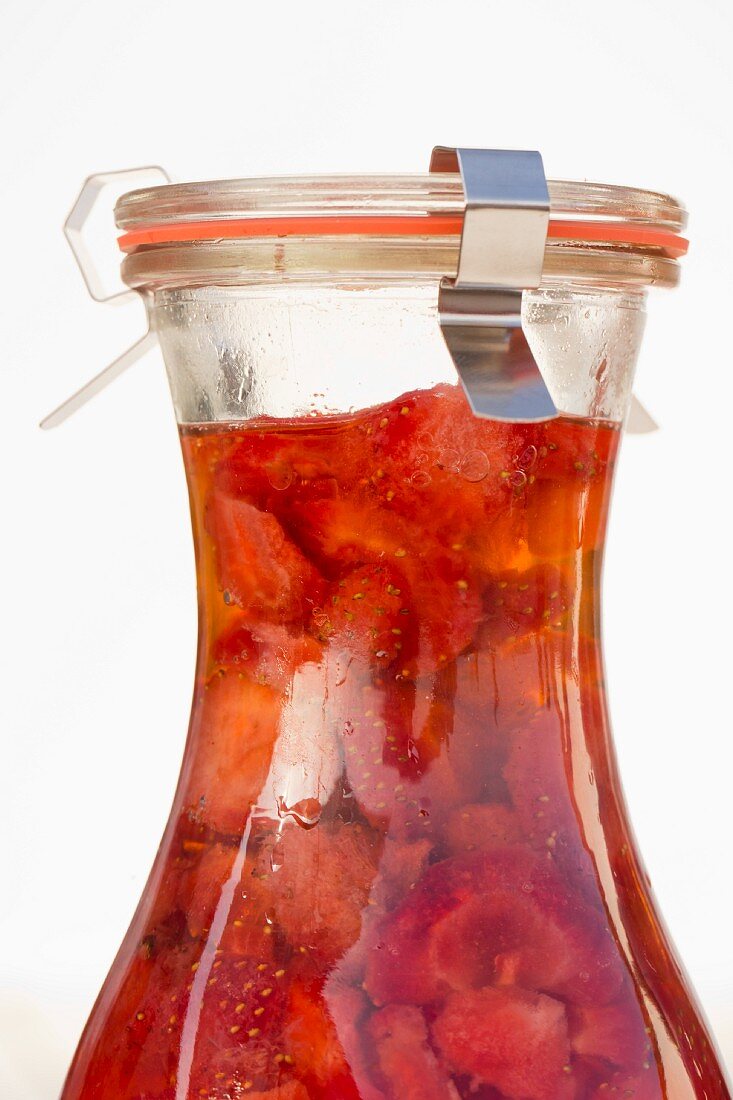 Strawberry vinegar in a preserving bottle