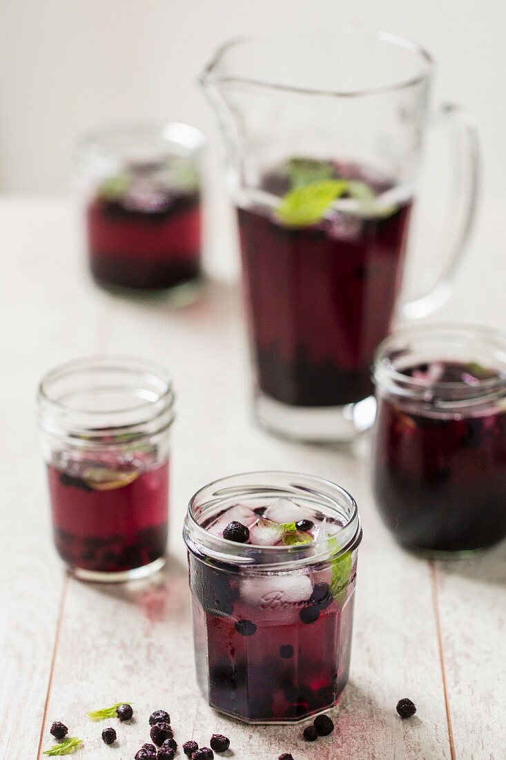 Blueberry punch with ice cubes and mint