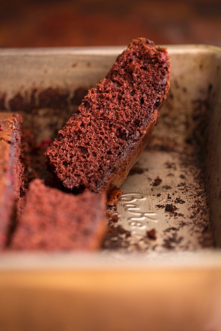 The remains of chocolate cake in a baking tin