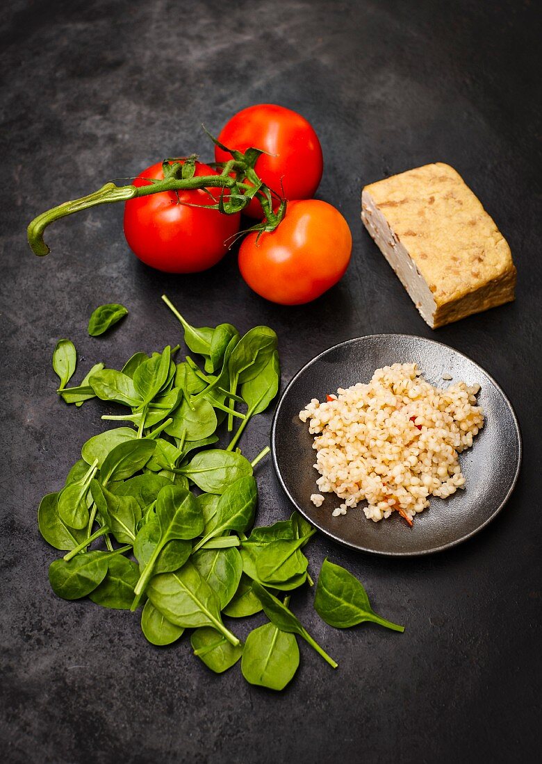 Ingredients for tomato and pearl barley risotto with peanut tofu and spinach
