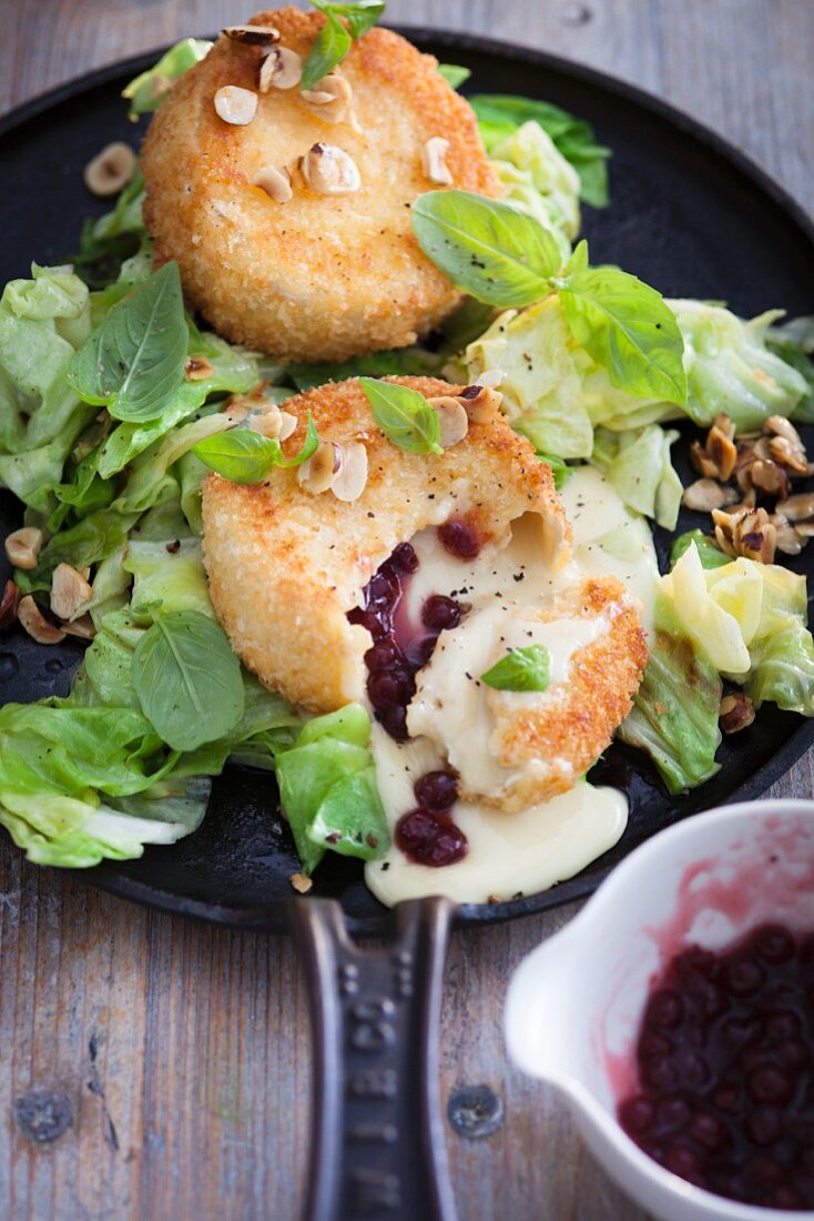 Lettuce with baked camembert, cranberries and hazelnuts