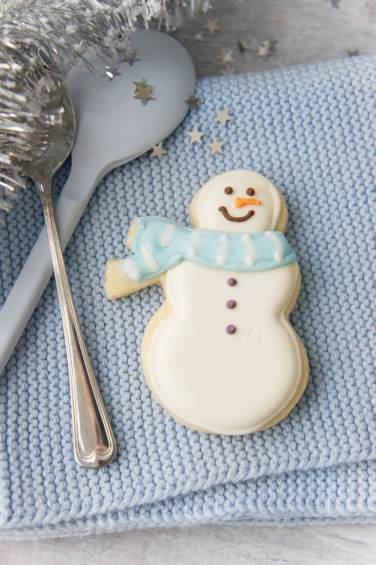 Cutlery with a snowman biscuit