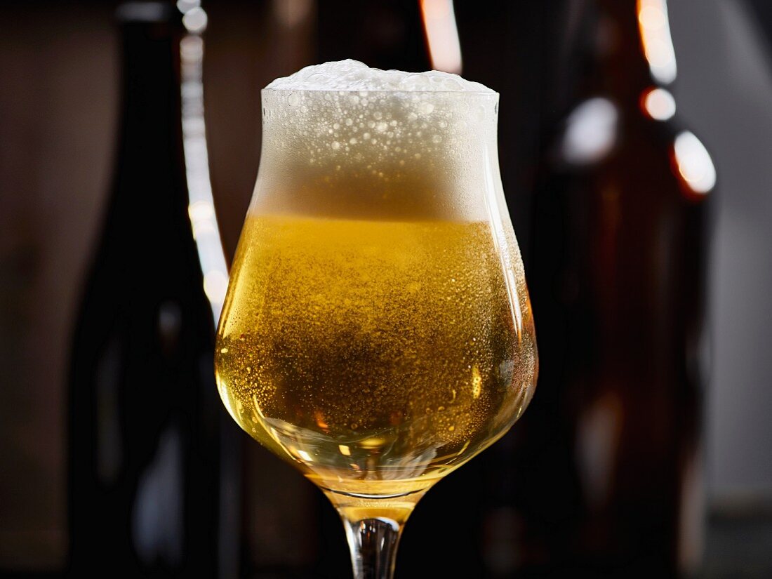 A glass of cold beer with condensation