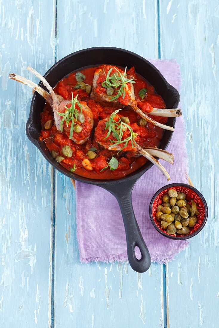 Lamb chops with a tomato and caper sauce