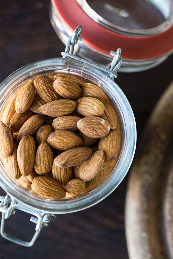 Almonds in a flip-top jar