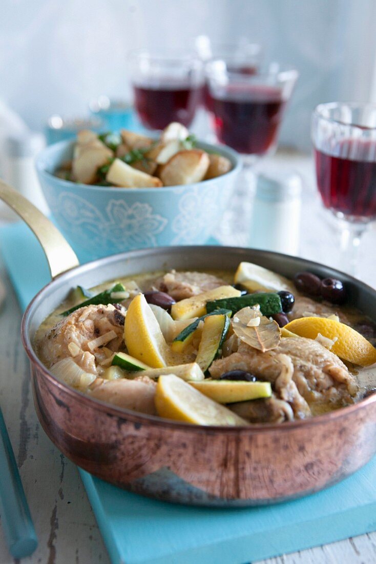 Chicken casserole with lemons, courgettes, olives and potatoes