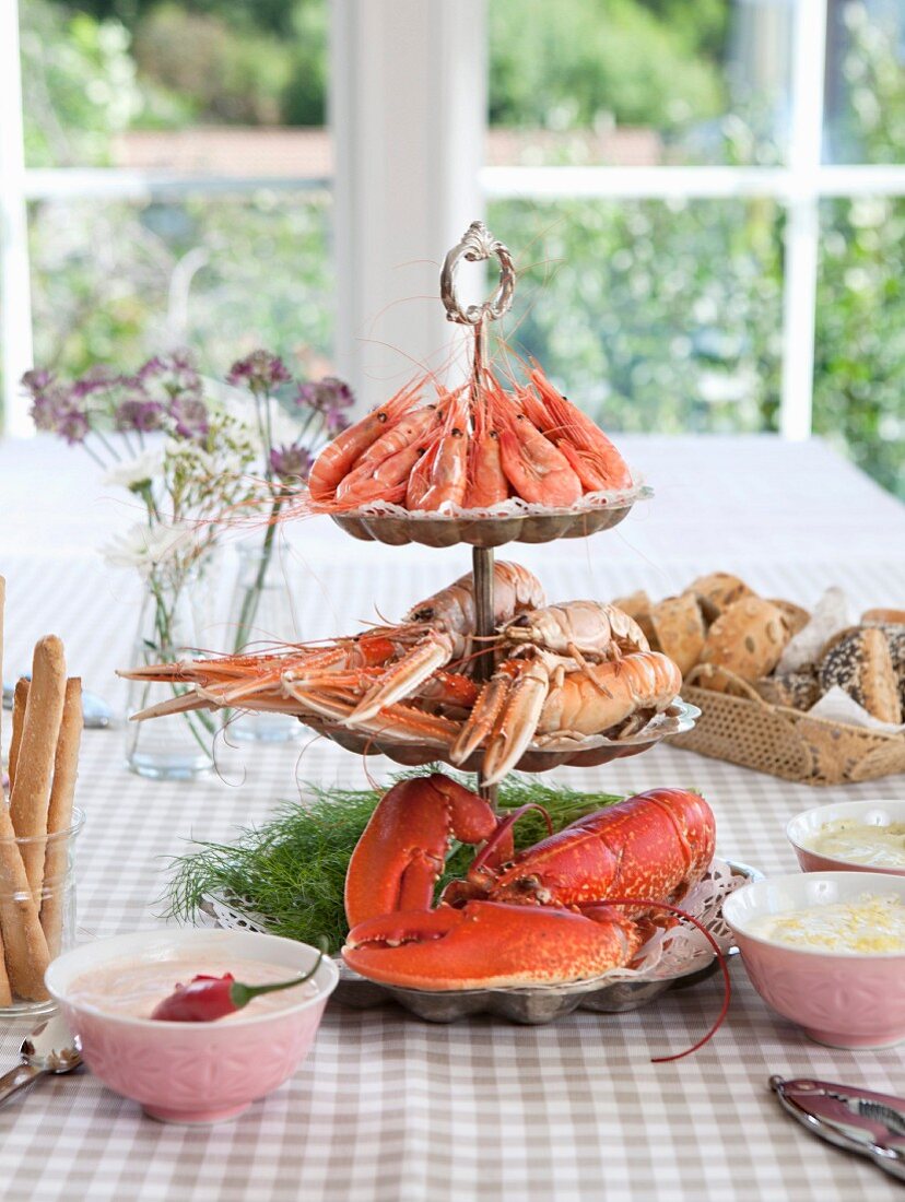 Various different crustaceans on the cake stand by laid table