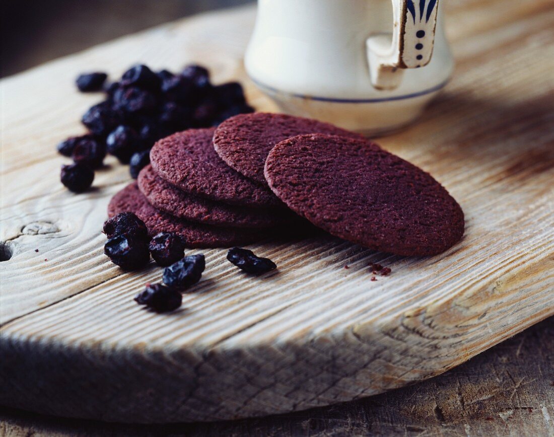 Blackcurrant biscuits on a rustic wooden board