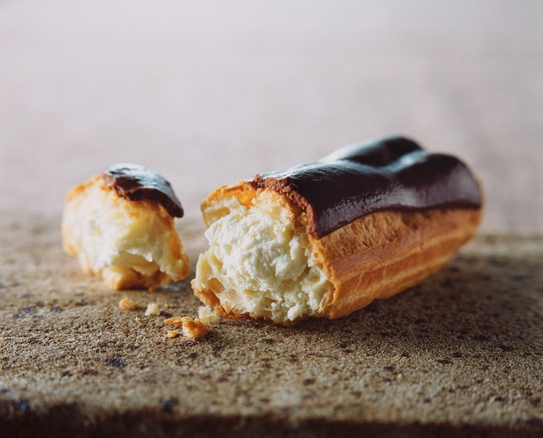 A broken eclair with chocolate glaze – License Images – 11953642 StockFood