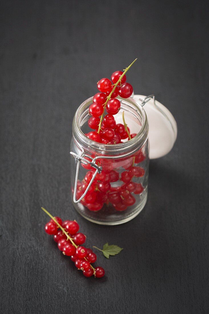 Redcurrants in a flip-top jar