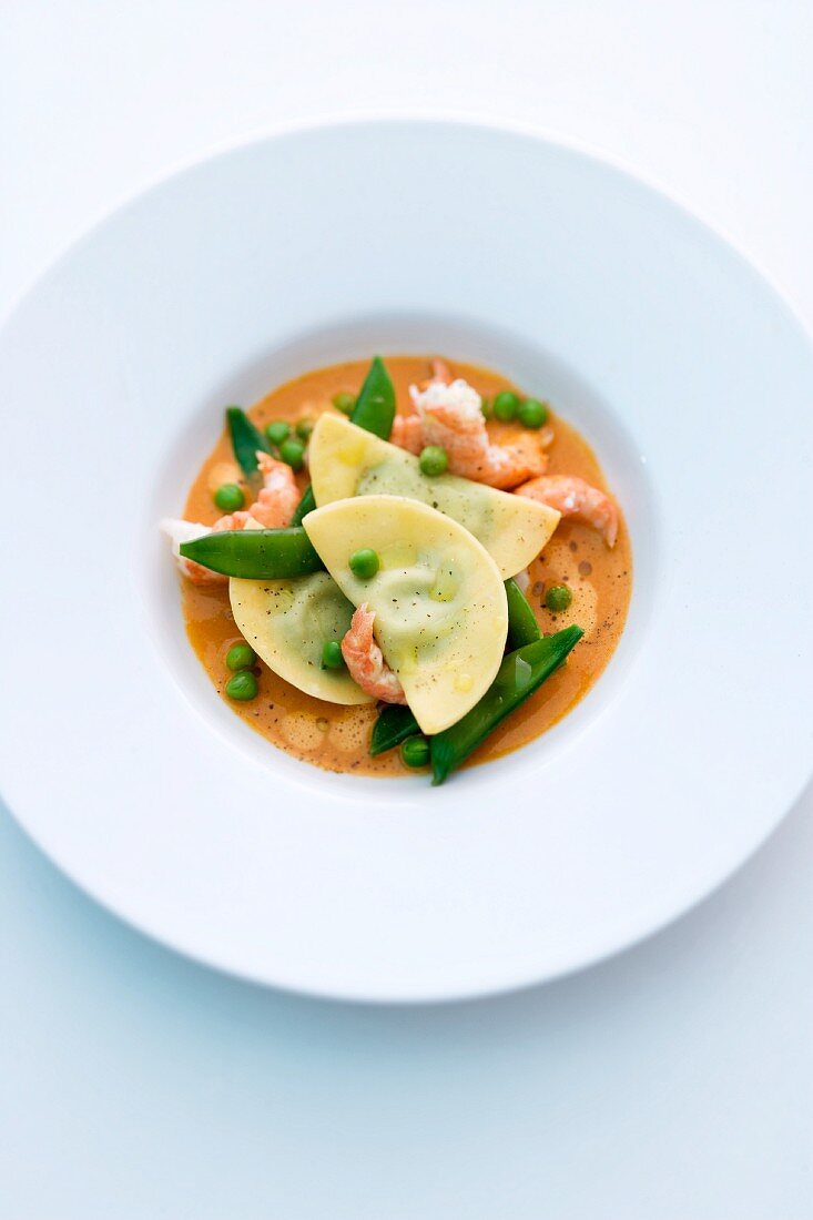 Crayfish with pea ravioli in a butter sauce