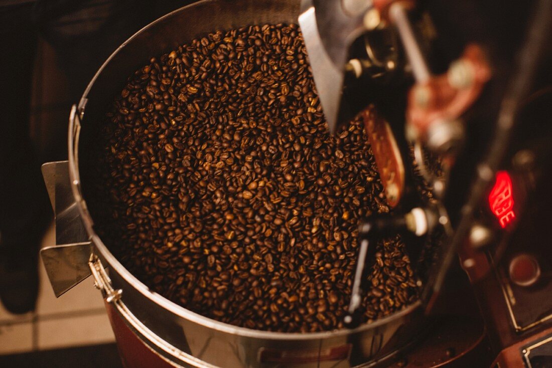 Roasted coffee beans in a roasting machine seen from above