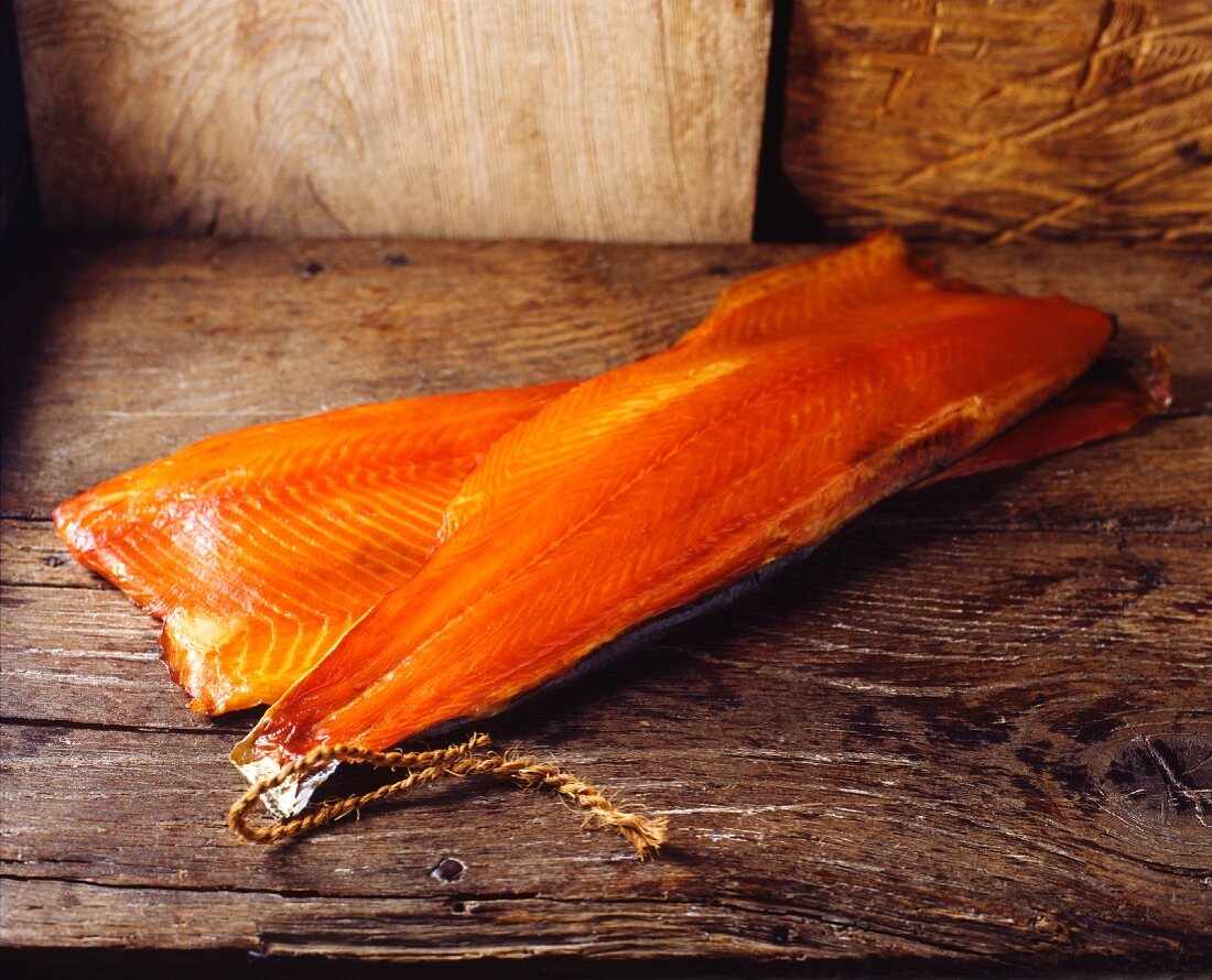 Smoked salmon on a wooden surface