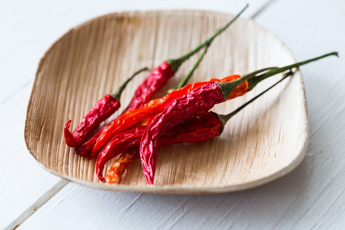 Dried chilli peppers in a bamboo bowl