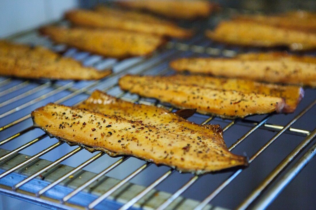Smoked trout fillets on a cooking grid