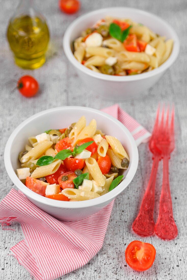Cold pasta with tomatoes, cheese and basil