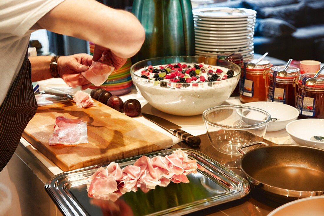 Ham being arranged on a platter