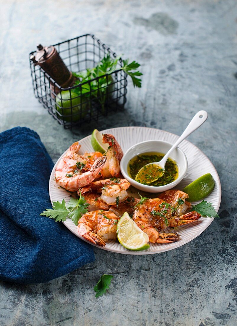 Fried king prawns with herb oil and limes