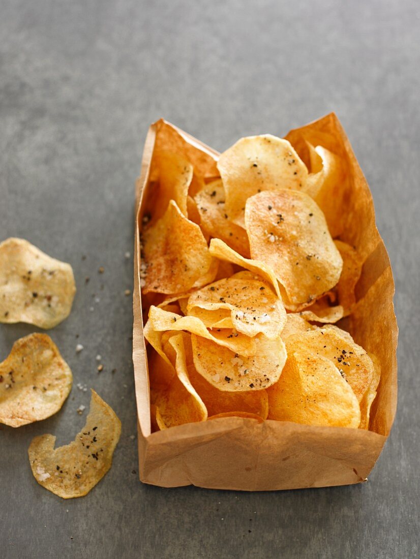 Potato crisps in a paper bag