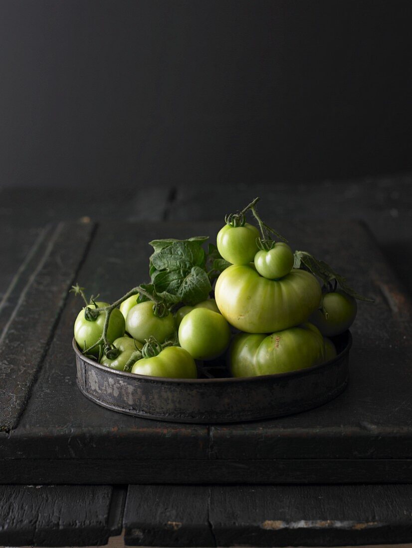 Green tomatoes on a metal tray