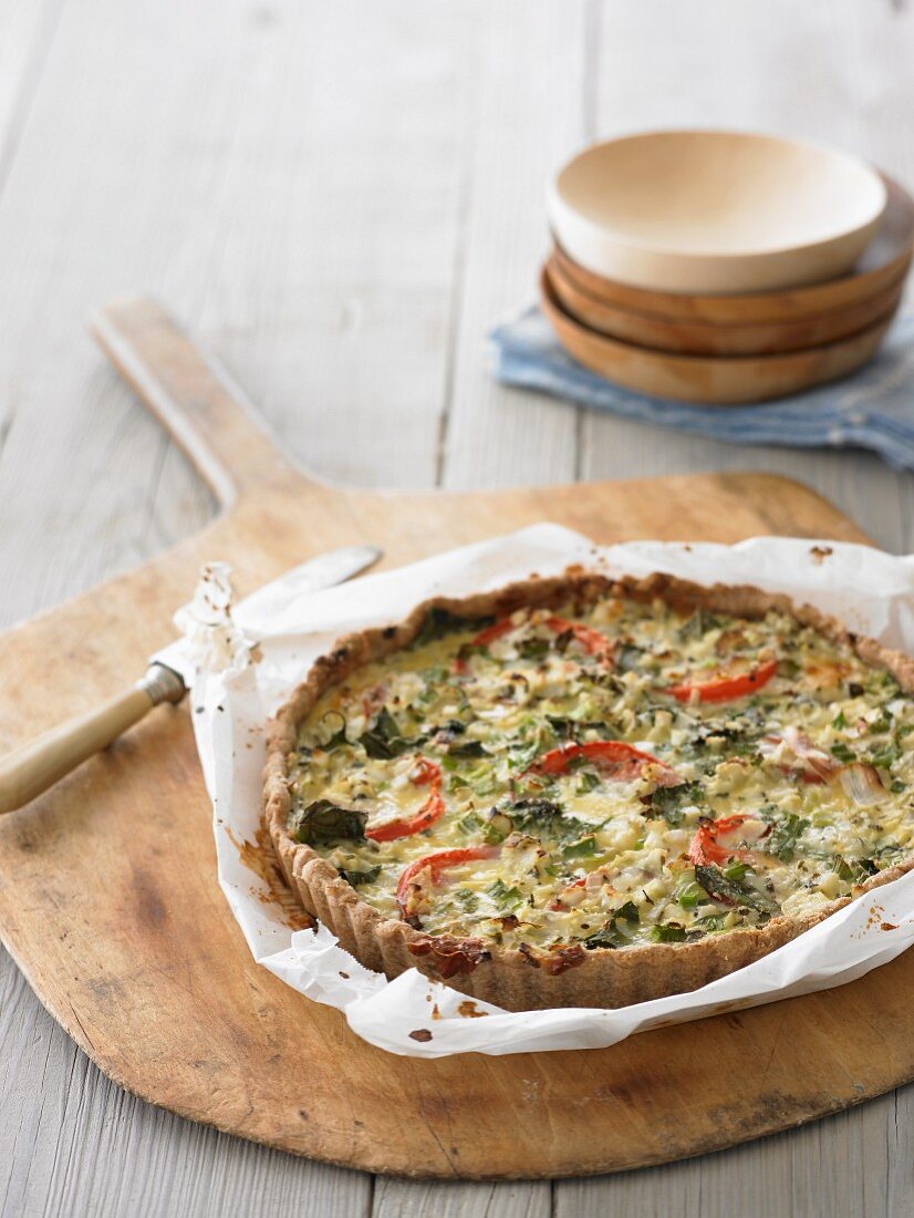 Tomato and basil tart on a piece of baking paper