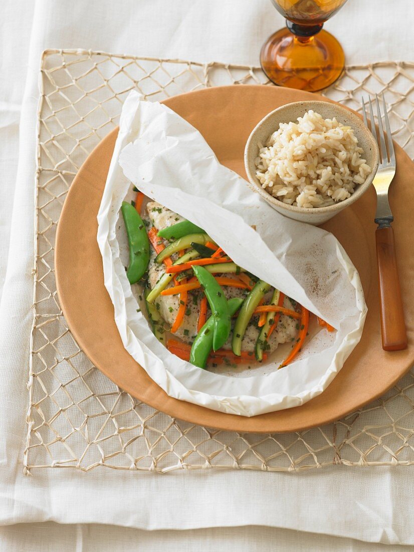 Steamed catfish with vegetables in parchment paper