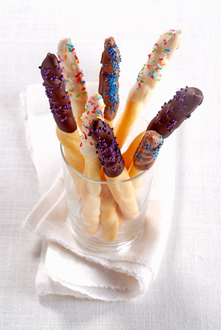 Chocolate glazed breadsticks with sprinkles