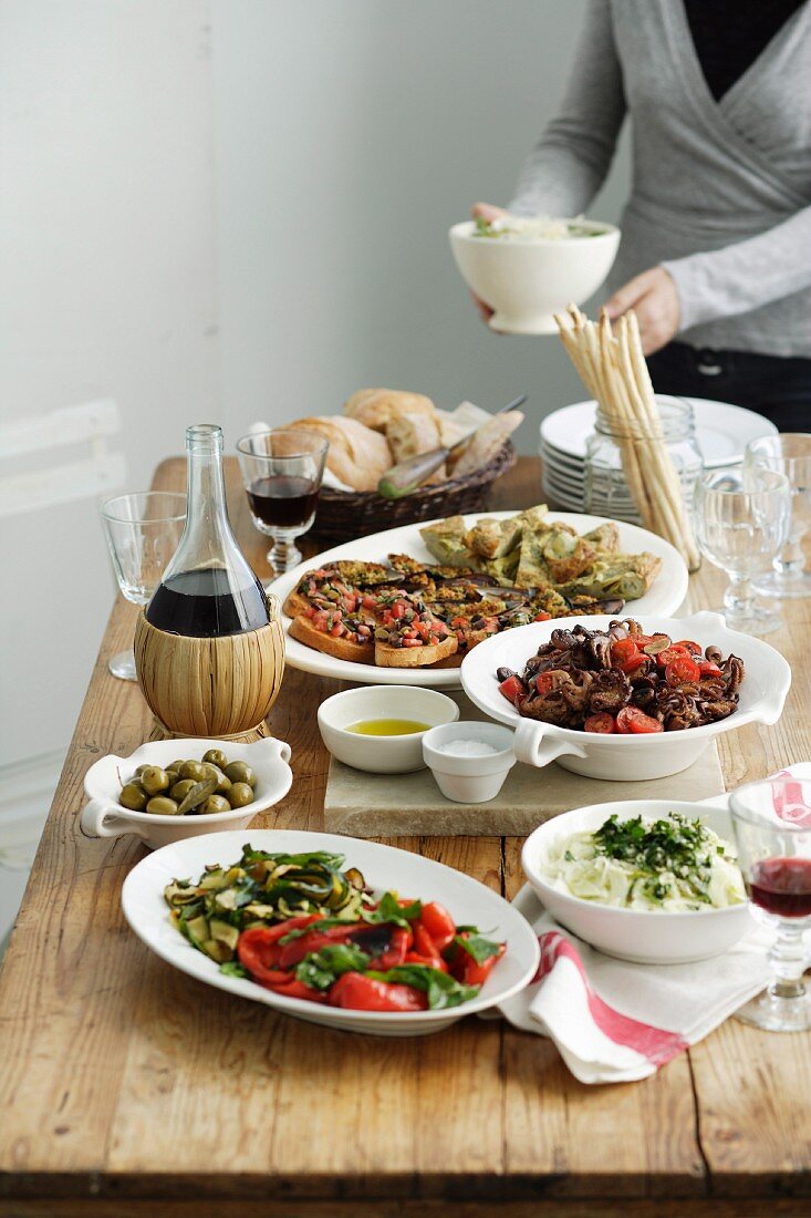 Woman setting Antipasto Table