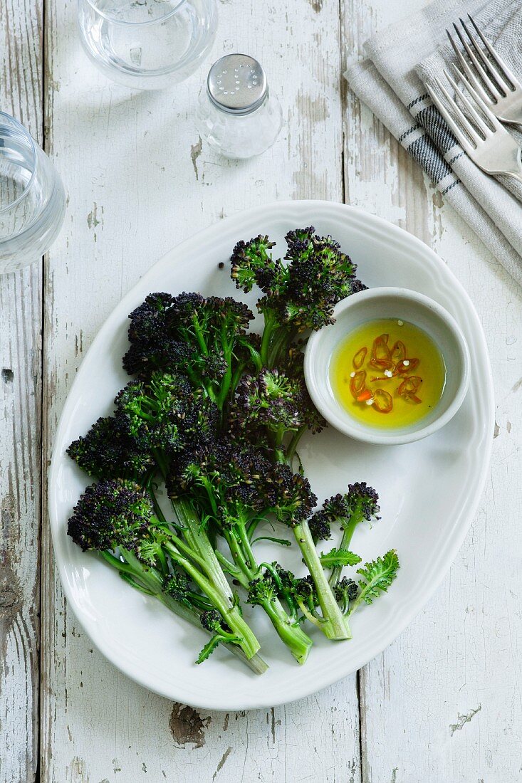 Steamed purple broccoli with chilli oil