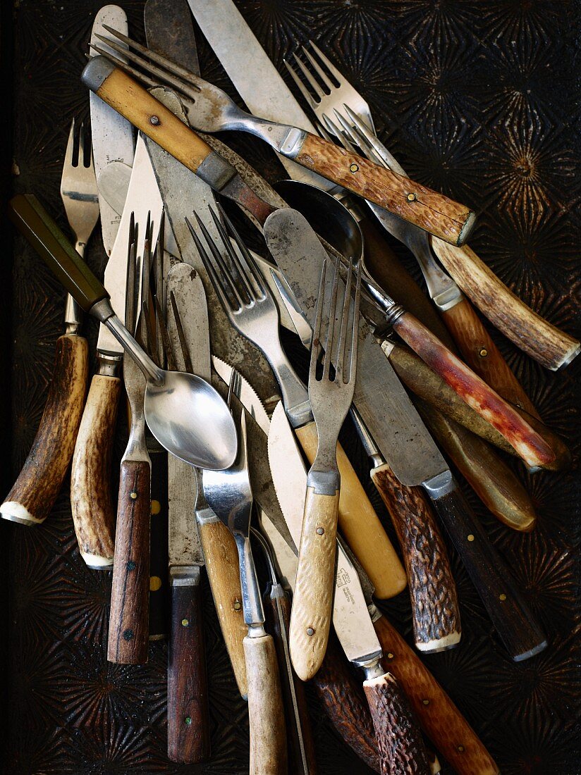 Various old forks, spoons and knives (seen from above)