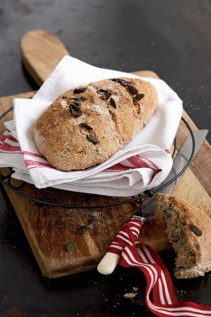 Homemade yeast bread with pumpkin seeds and cranberries