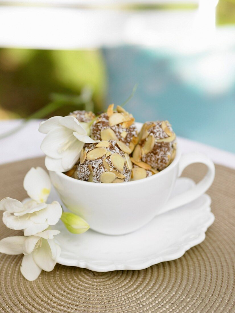 Coconut truffles with almond flakes