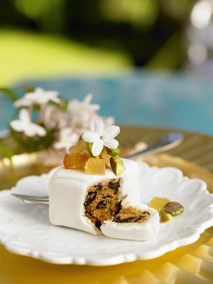 Small fruit cake with candied fruits and pistachios